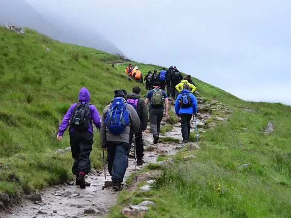 Group hiking up Yorkshire 3 peaks Challenge