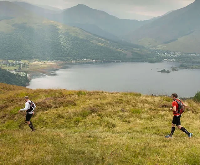 2 men walking across Coast to Coast